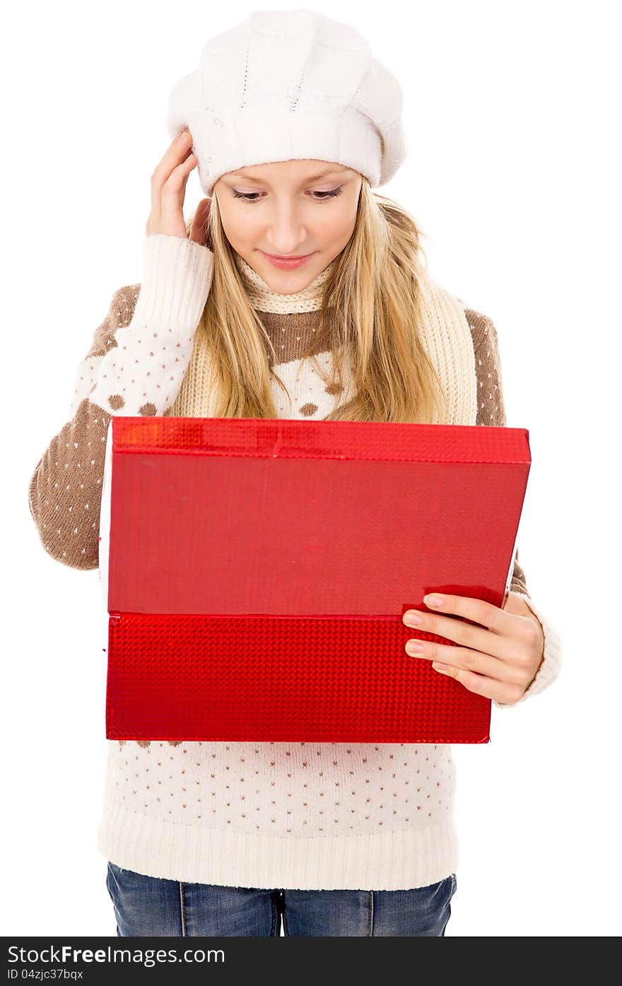 Girl looks in a gift box and wondering isolated