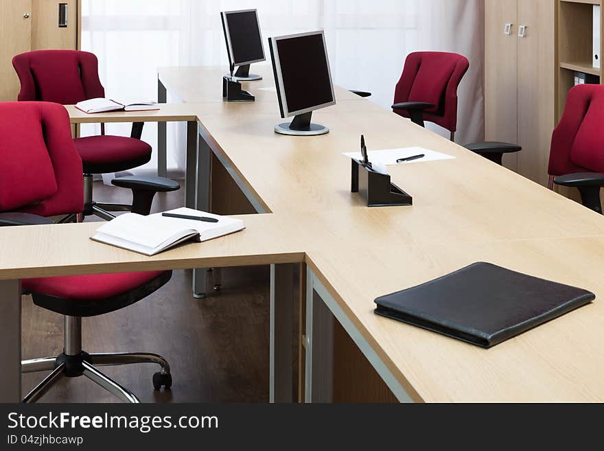 Monitors on the desks in a modern office