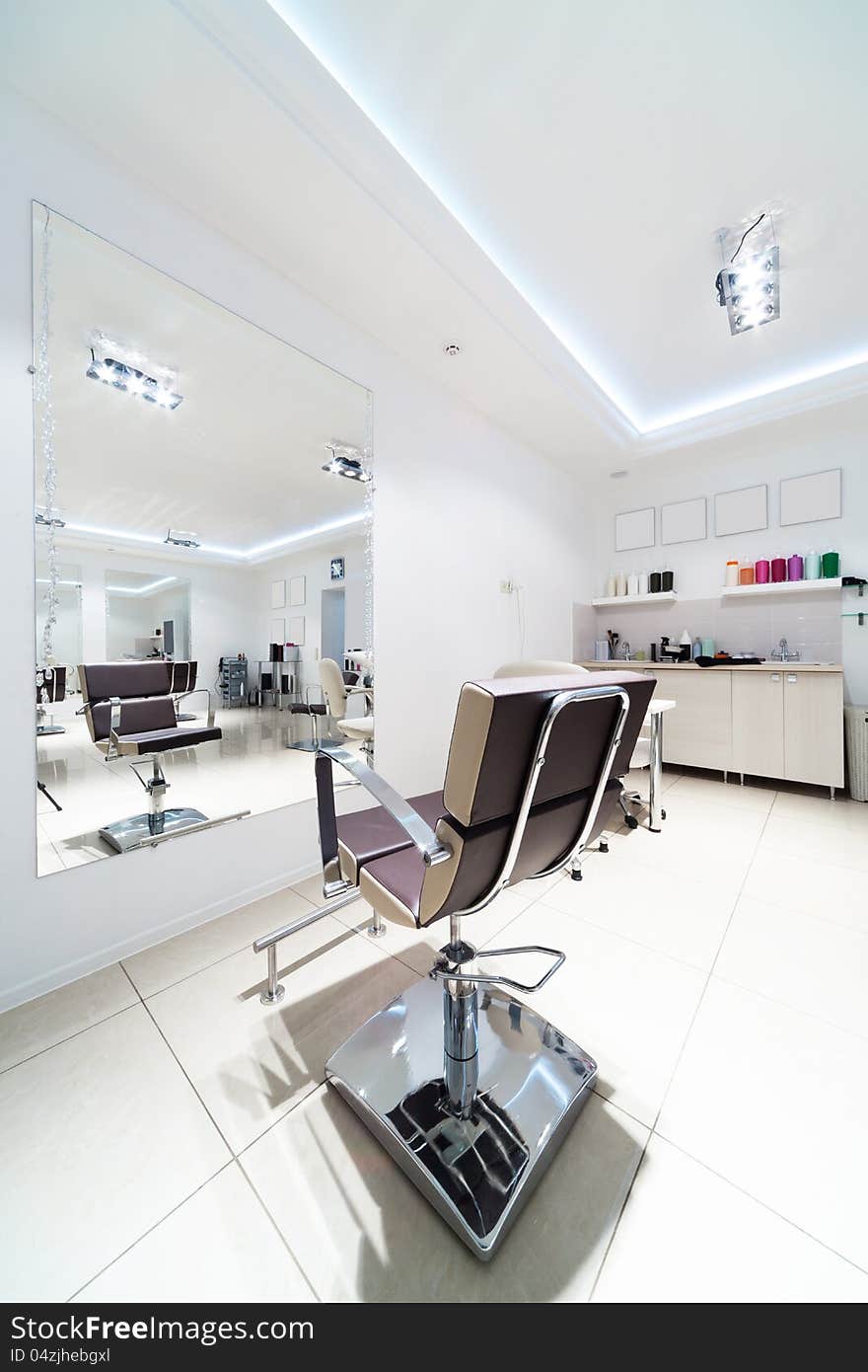 Chairs and mirrors in hairdressing