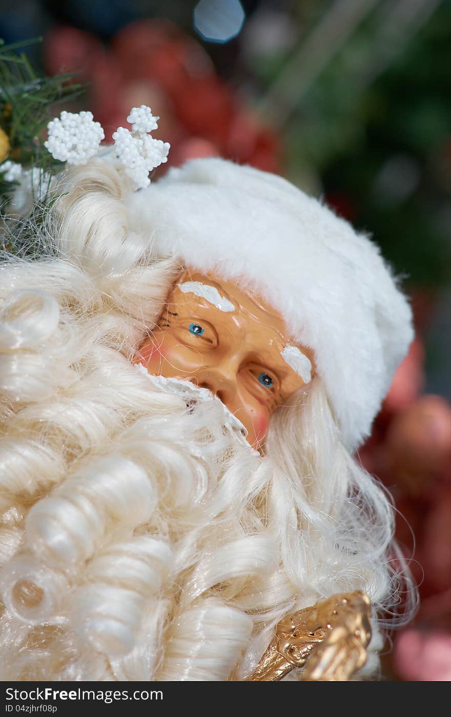 Toy Santa Claus, near green ornamentation fir-tree, toys