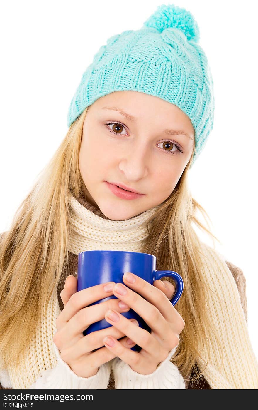 Portrait of a girl in a cap and a mug