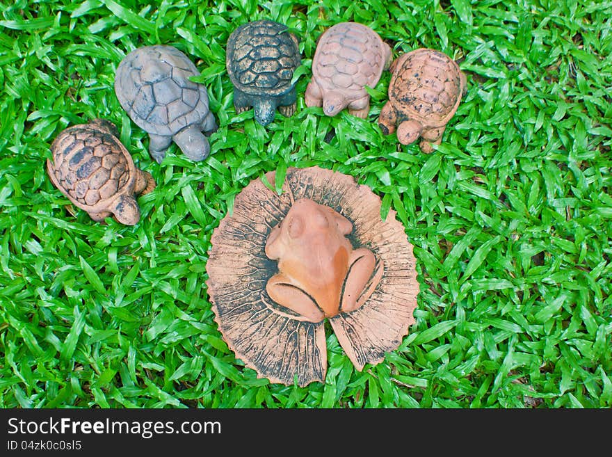 A pottery of frog and turtles on the yard