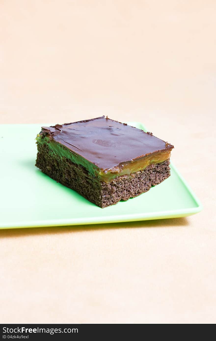 Slice of chocolate Cake. Sachertorte on a green plate. Slice of chocolate Cake. Sachertorte on a green plate