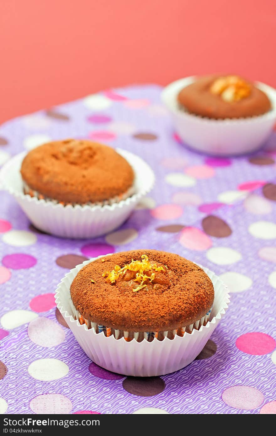 Chocolate cupcakes with on color background