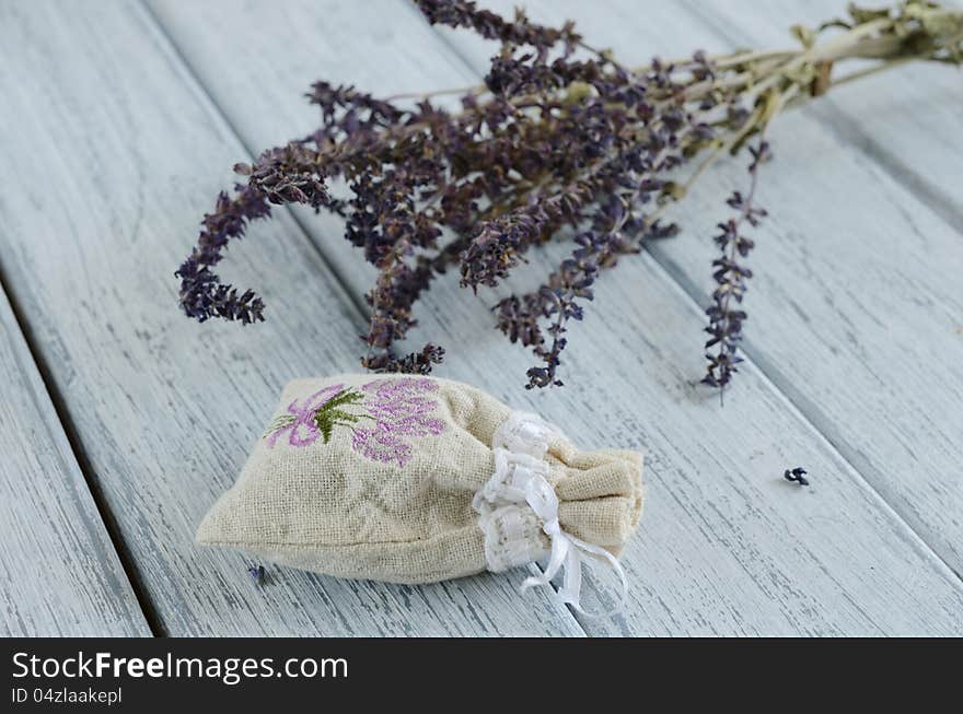 Lavender aroma bag on wooden background