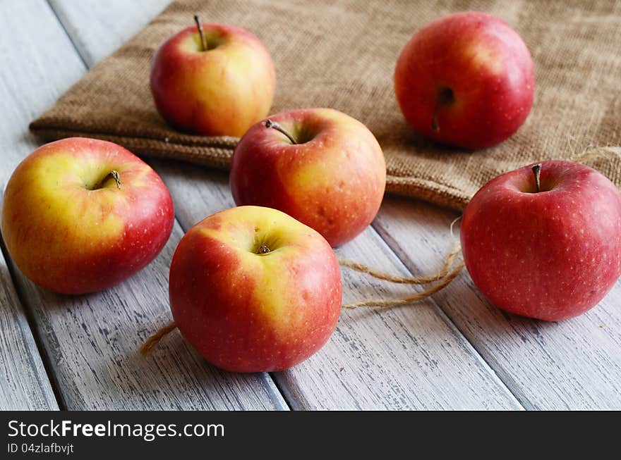 Ripe red apples on shabby wooden surface. Ripe red apples on shabby wooden surface