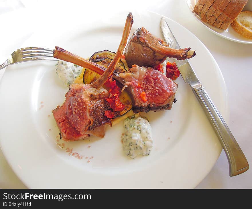 Lamb chops on a bed of vegetables