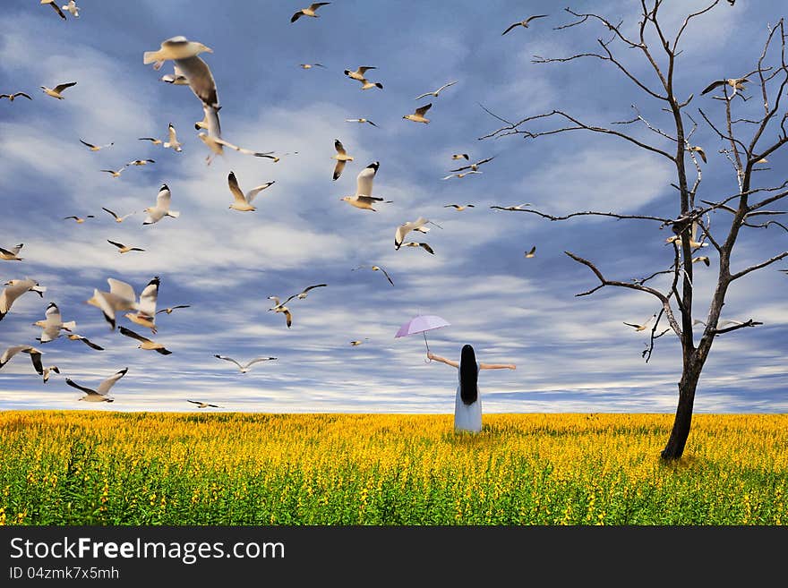 Young Girl Standing On Flower Field