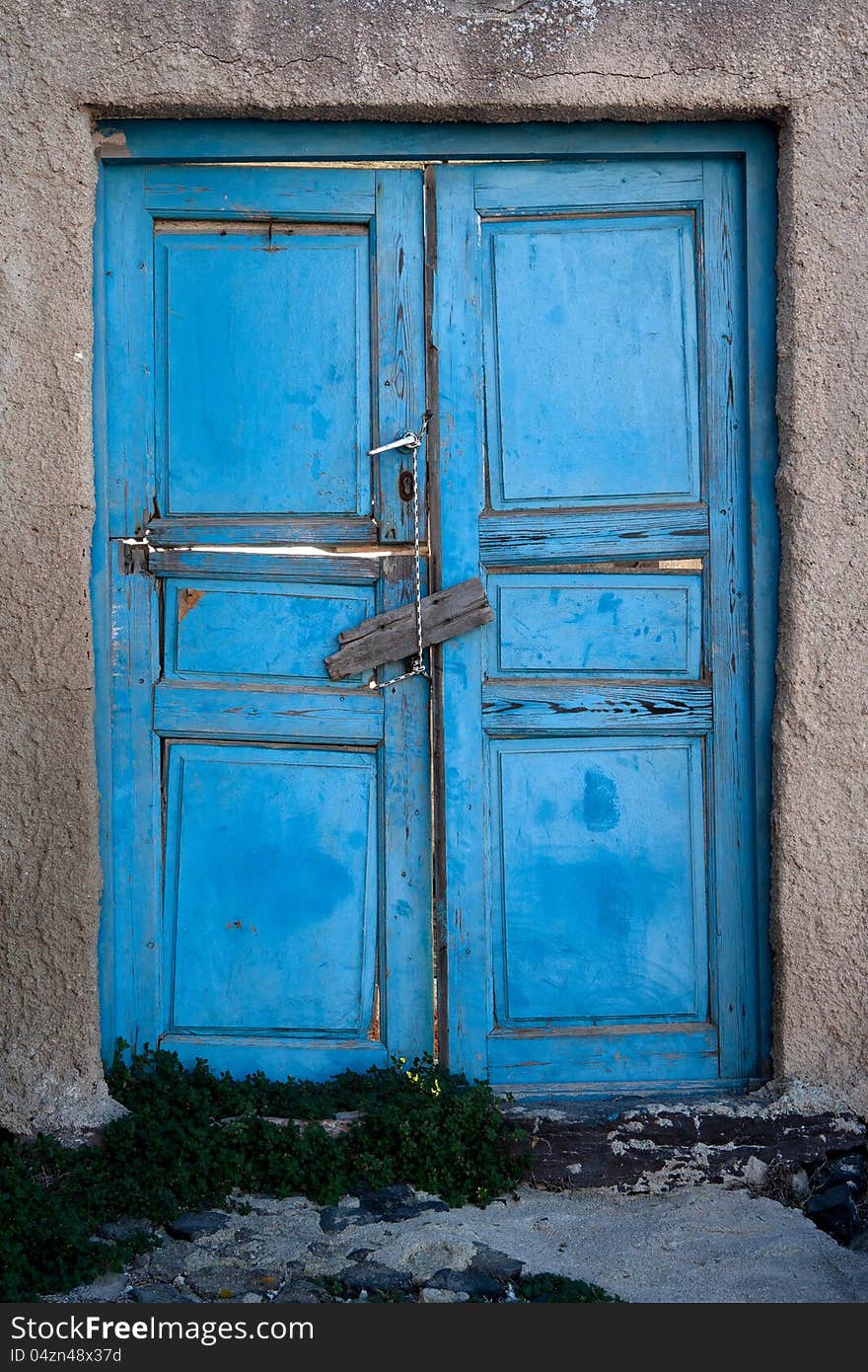 Old door of blue color. Santorini Island, Greece