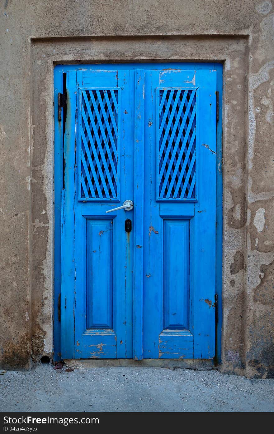 Old door of blue color. Santorini Island, Greece