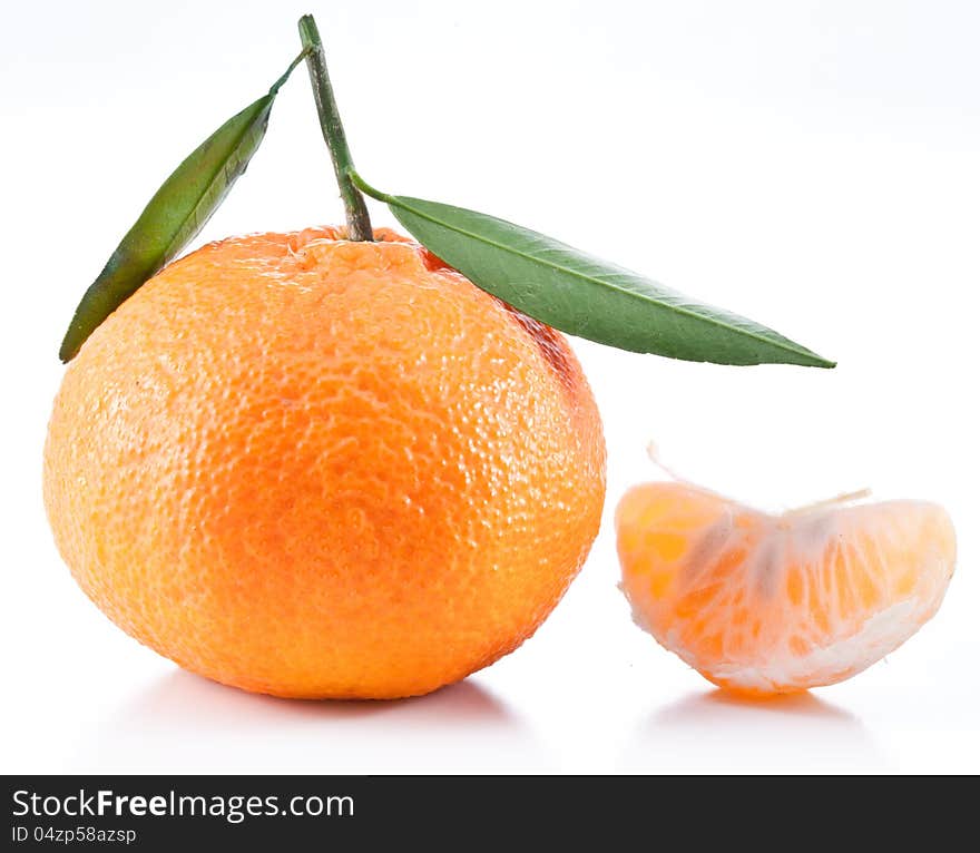 Tangerines with leaves on a white background. Tangerines with leaves on a white background.