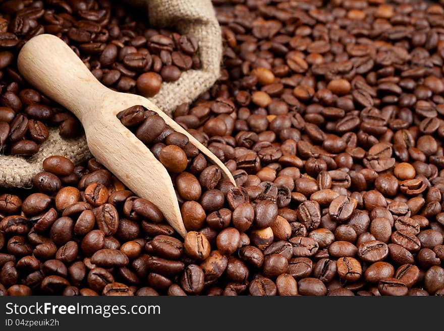 Coffee beans with wooden scoop