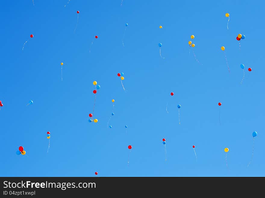 A lot of balloons in the blue sky