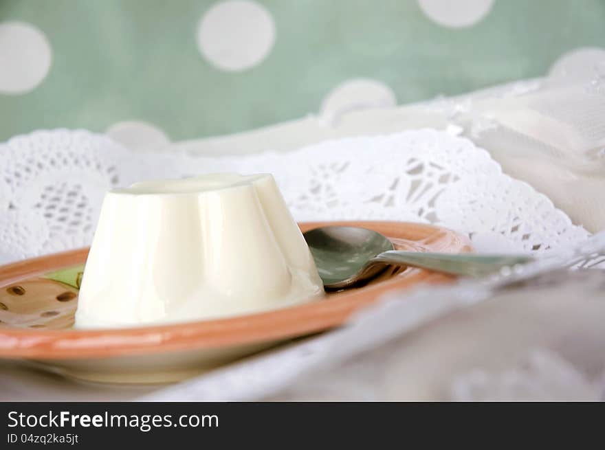 Milk pudding dessert serve on plate with sweet background