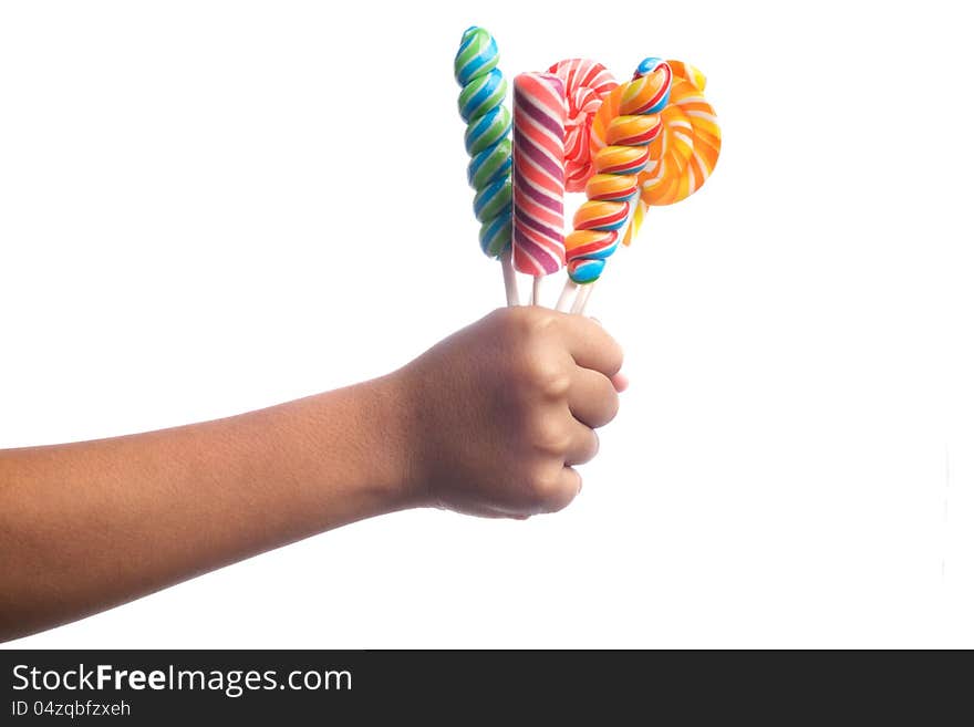 Child's hands holding candy isolated on white. Child's hands holding candy isolated on white