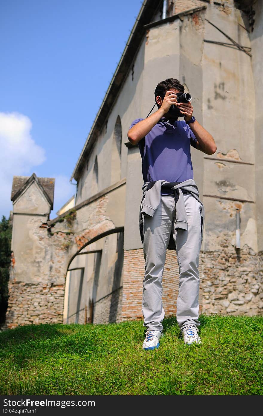 Tourist photographing ruins