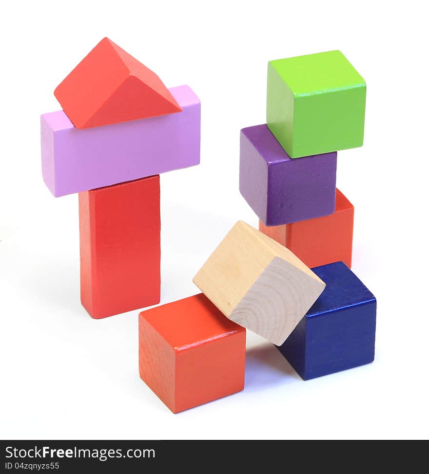 Colorful wooden building blocks on white background