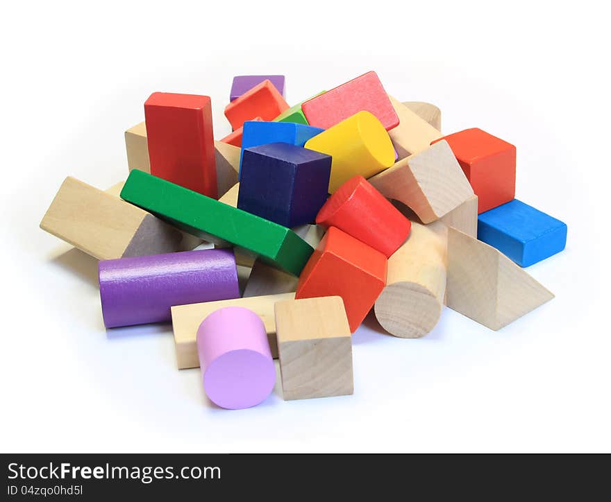 Stack of colorful wooden building blocks on a white background