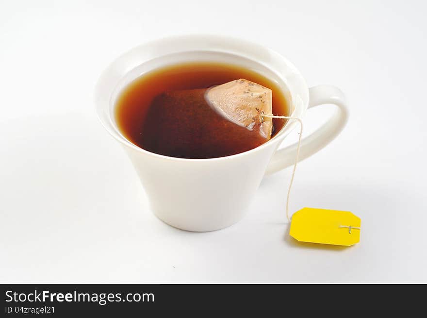 A cup of black tea on the white background