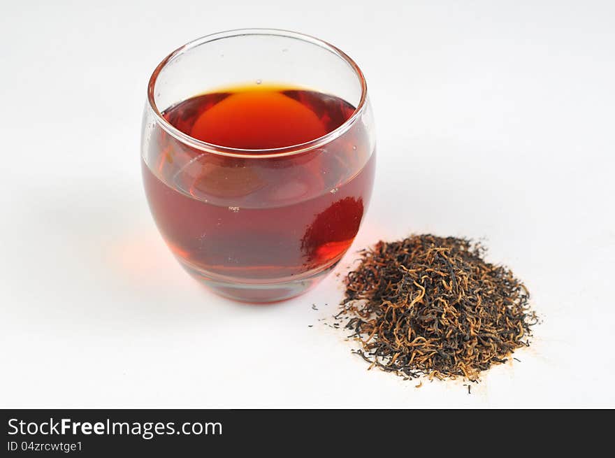 A cup of black tea on the white background