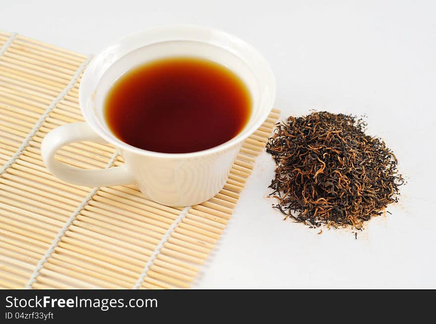 A cup of black tea on the white background