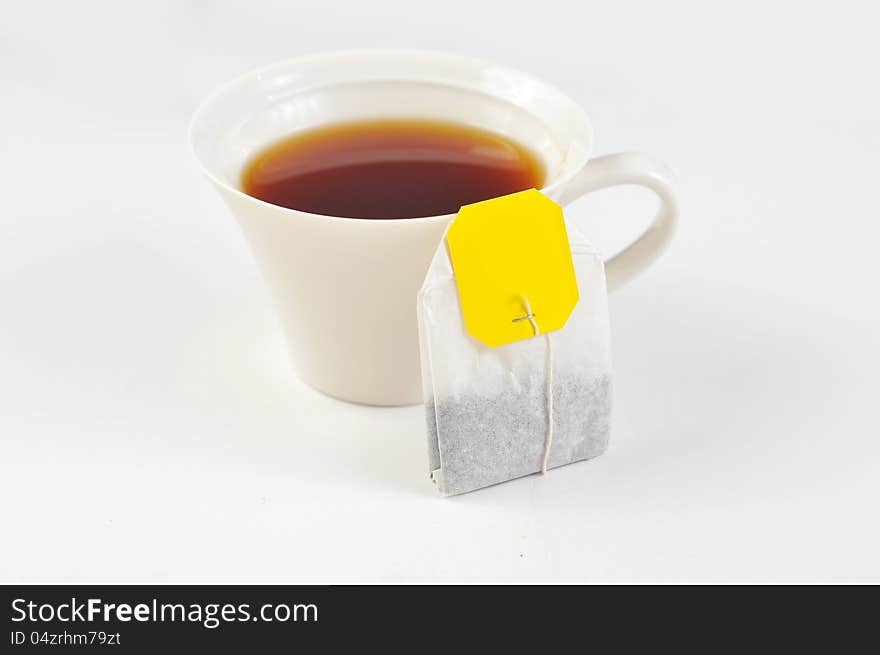 A cup of black tea on the white background