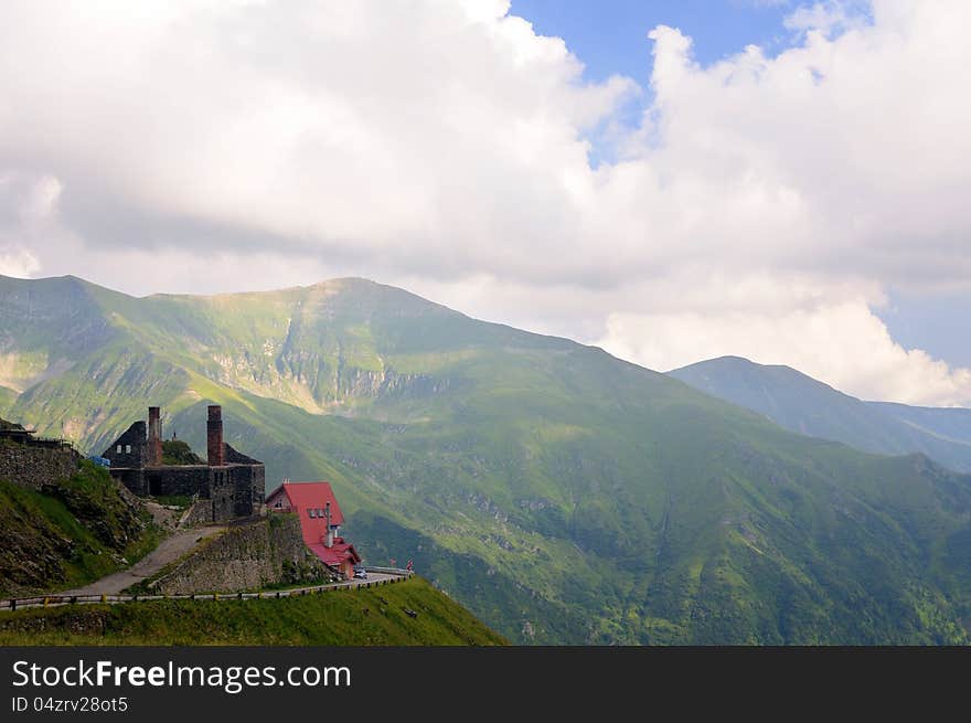 Beautiful mountain road view with old building ruins and clouds. Beautiful mountain road view with old building ruins and clouds.