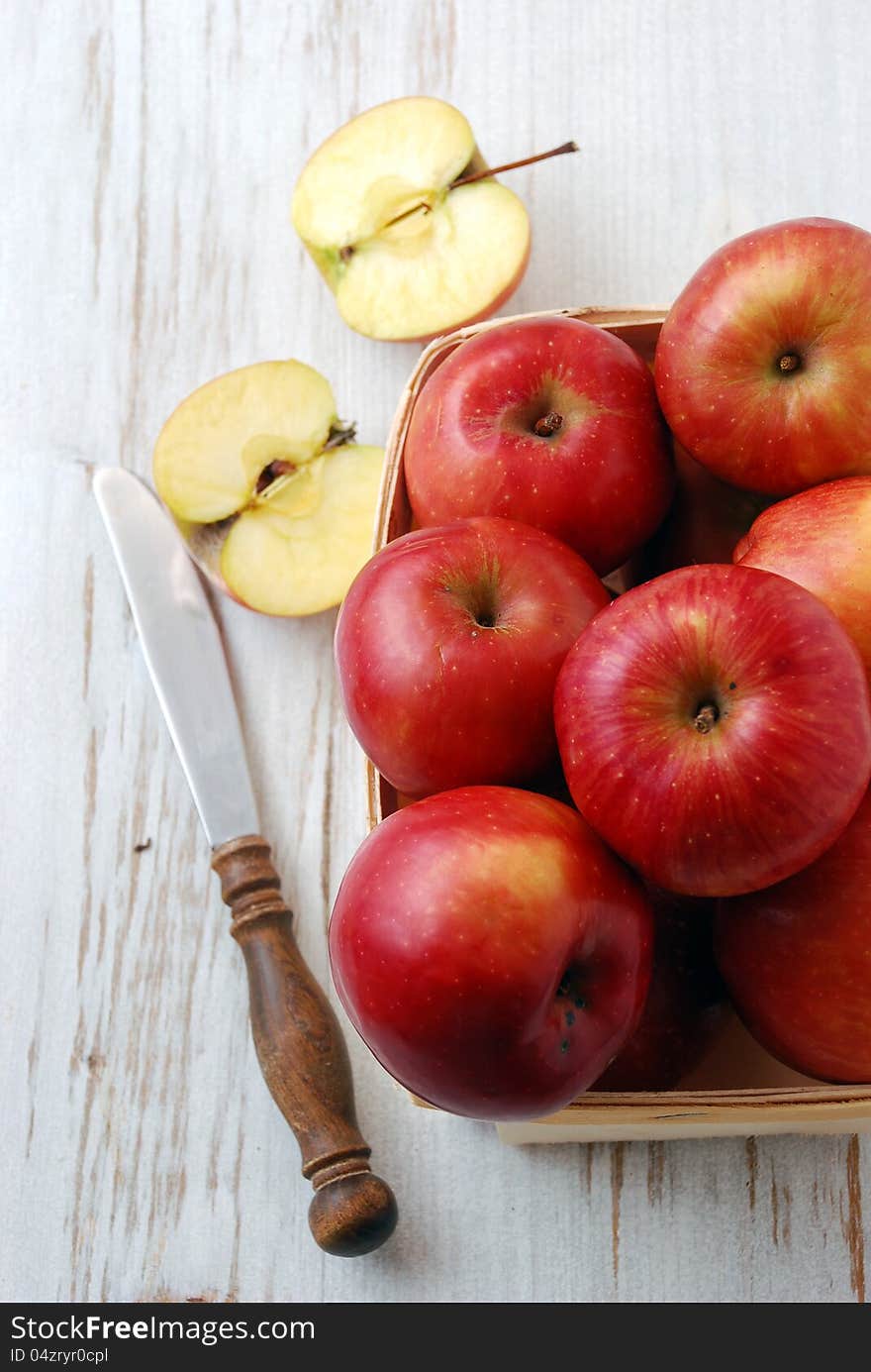 Beautiful red apples on wooden table