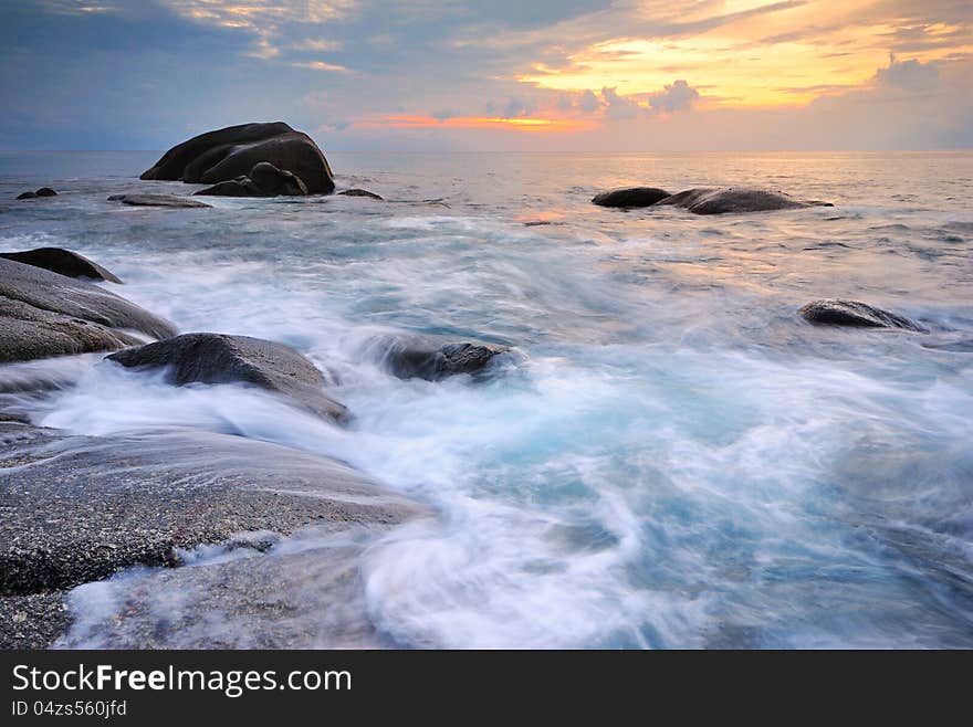 Sea waves lash line impact rock on the beach. Sea waves lash line impact rock on the beach