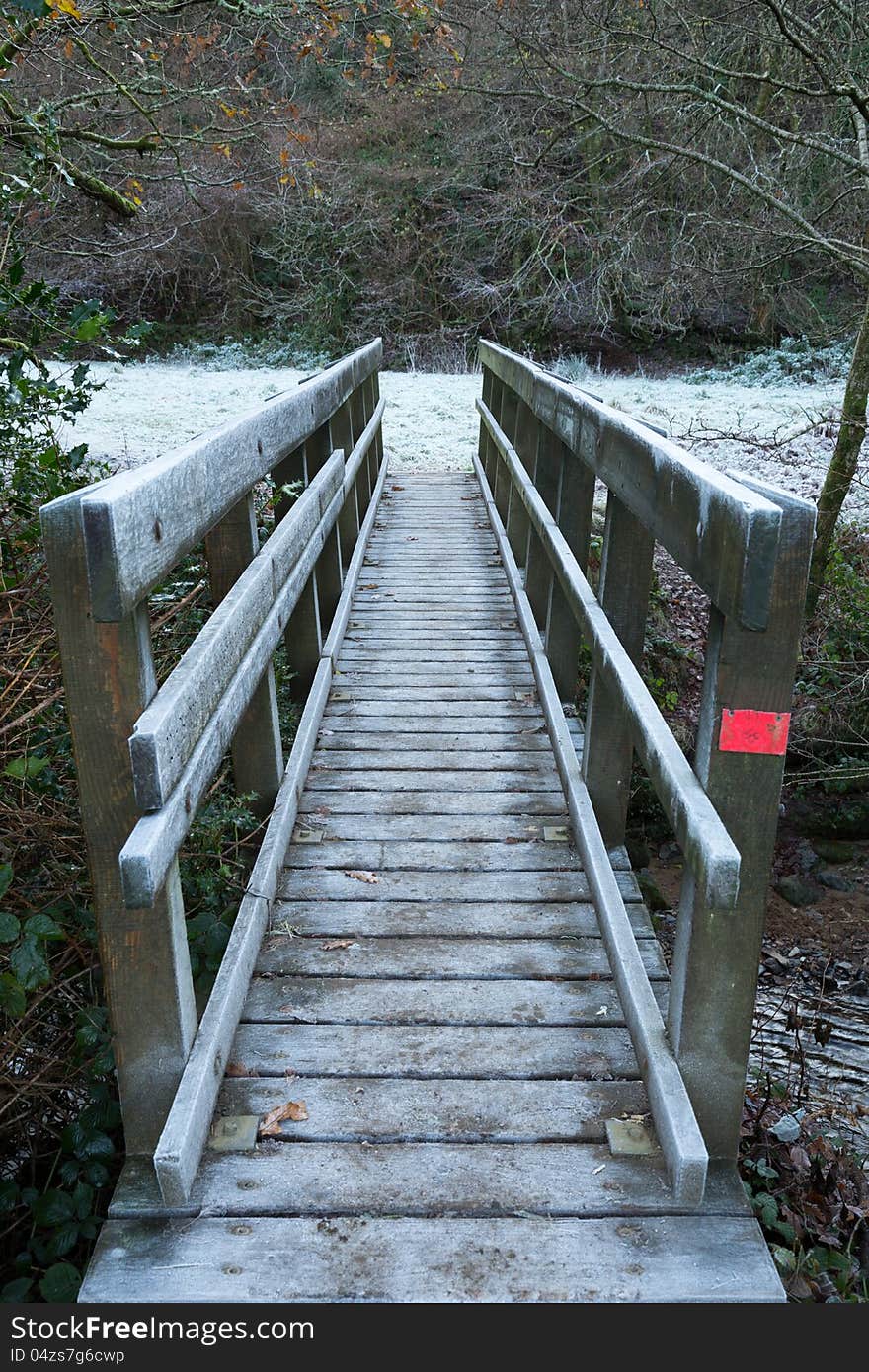 Wooden Bridge Crossing A River