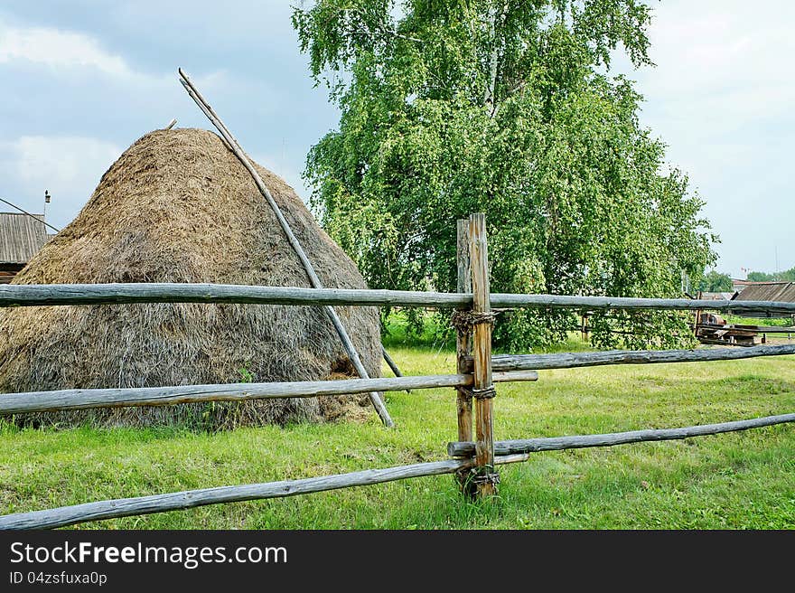 Haystack and birch tree in the village of summer. Haystack and birch tree in the village of summer.