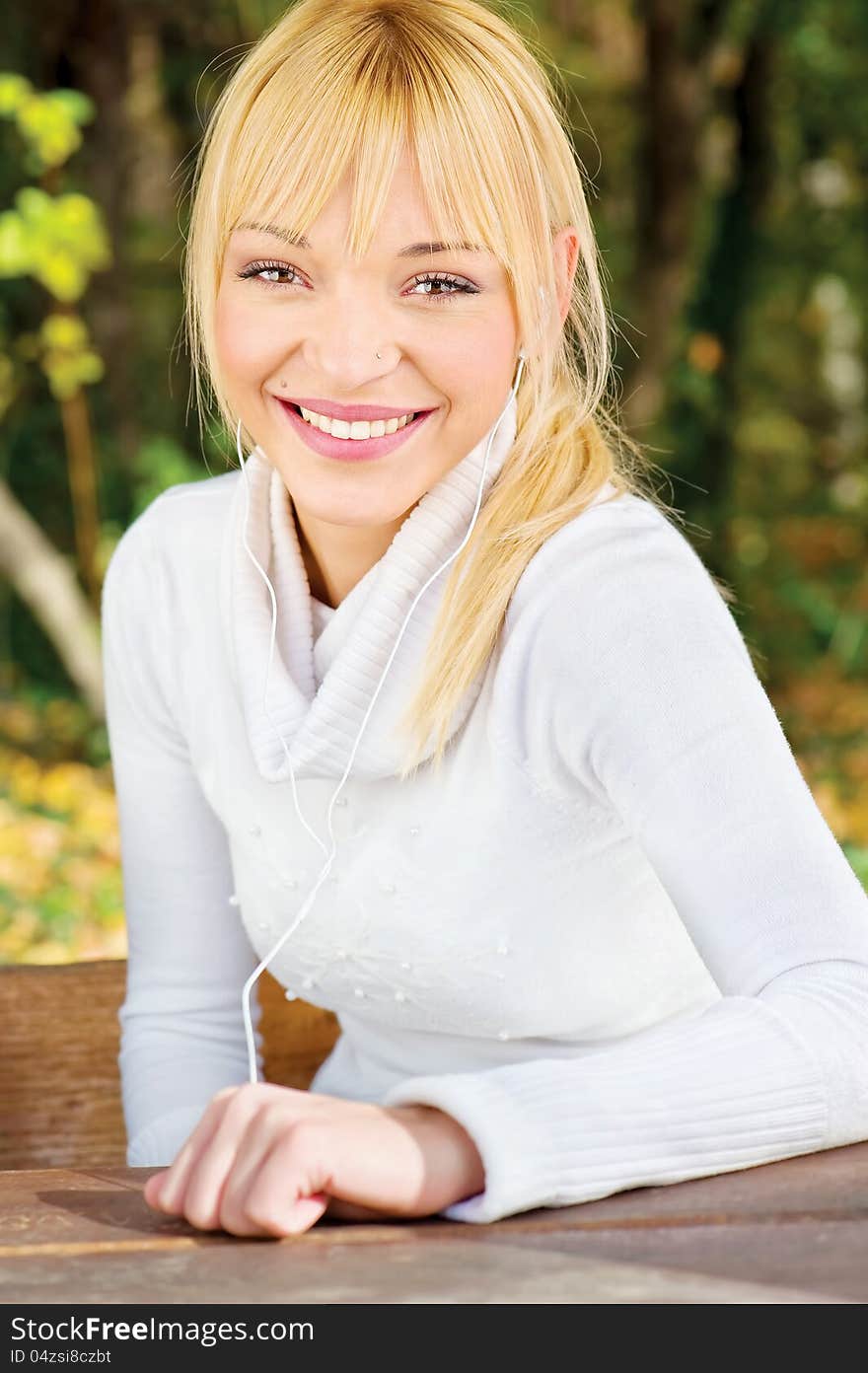 Woman with headphones in park