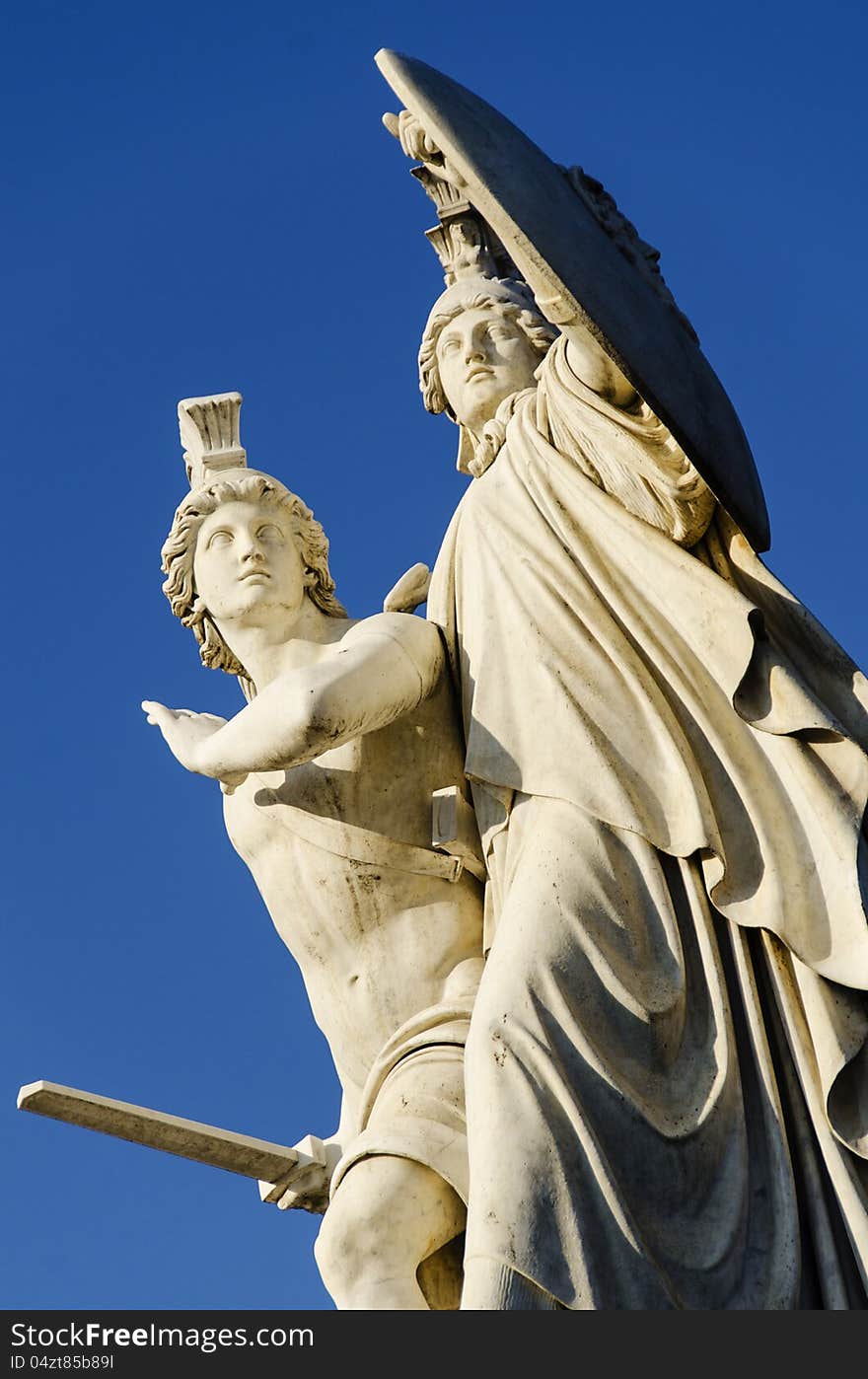 A youth attacking the enemy, protected by Athene at his side, statue on Schlossbrucke bridge , Berlin