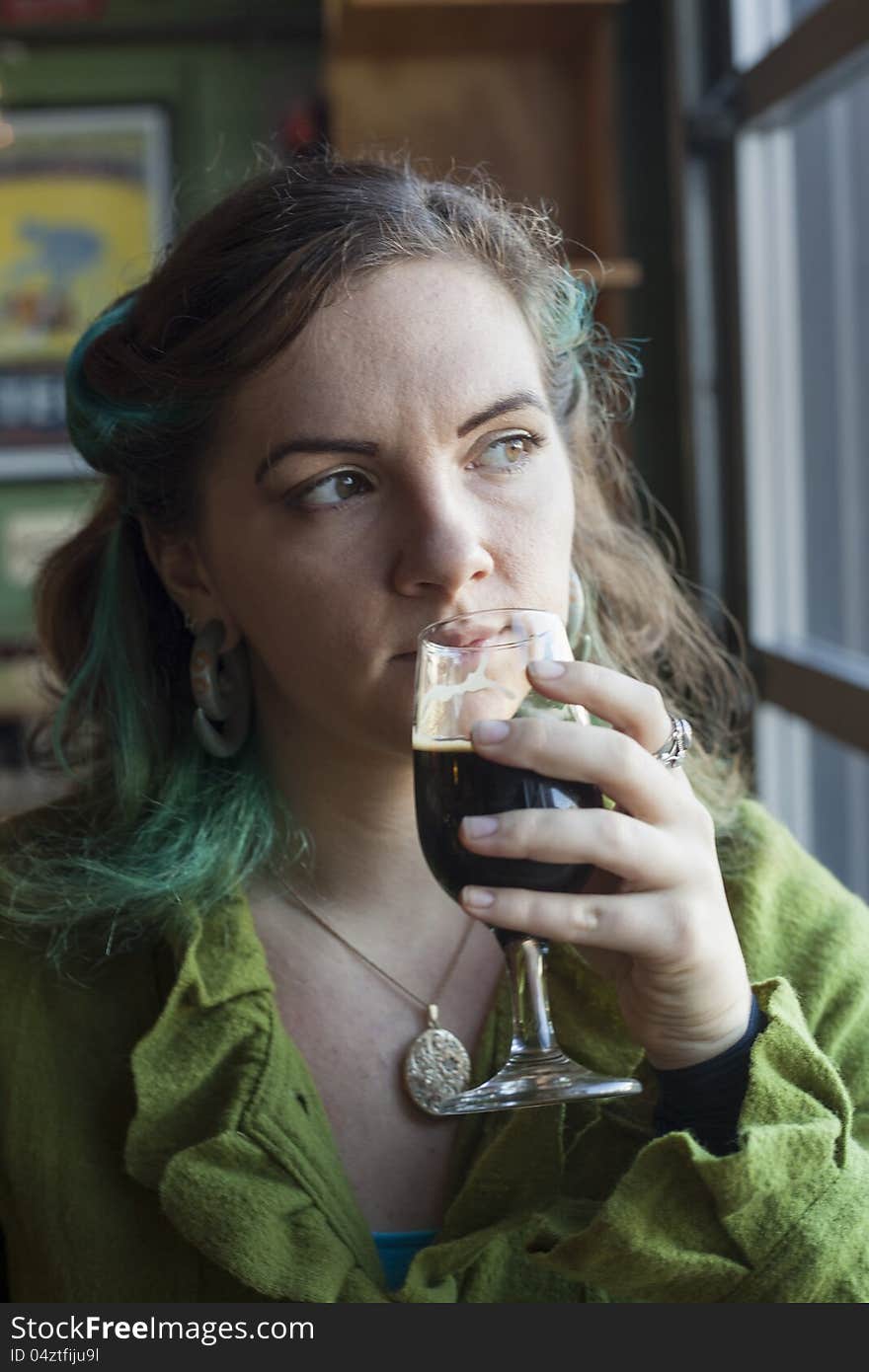 Young Woman Drinking Beer