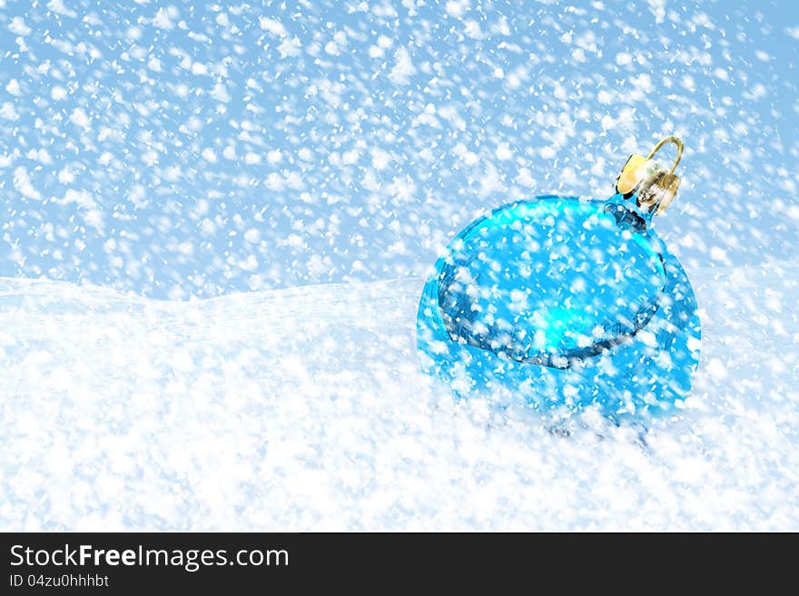 Blue Christmas ball on the snow