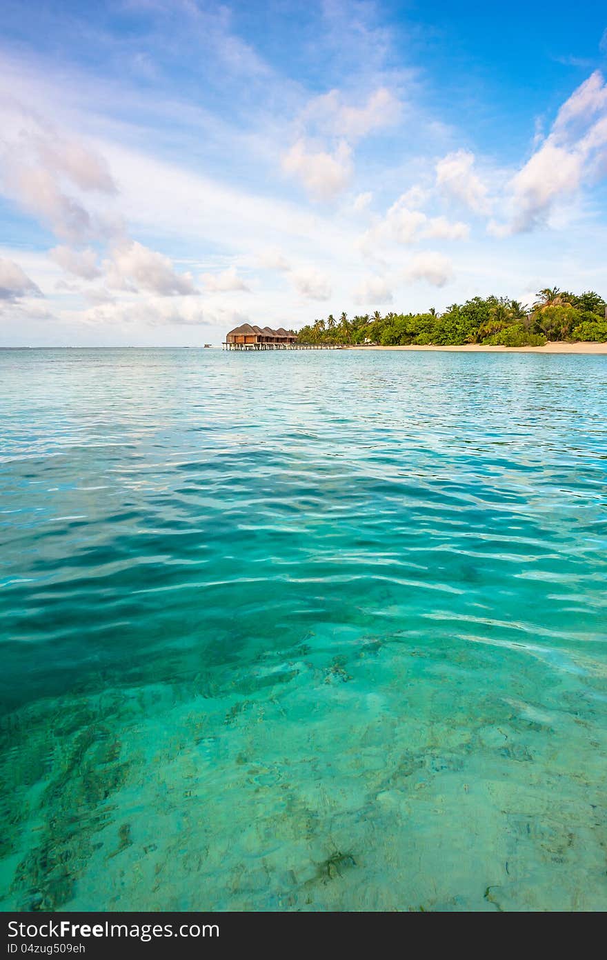 Landscape of the ocean and tropical island with blue sky