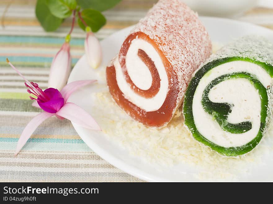 Sweet dessert with fuchsia in a plate, closeup