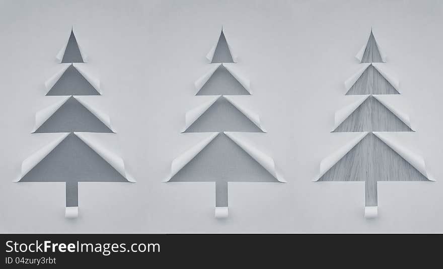 Three Christmas trees made of paper for design