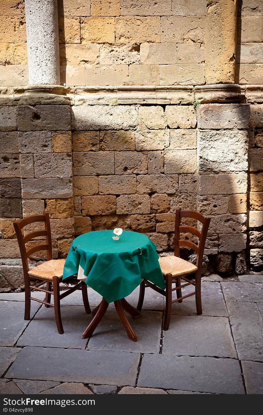 Table for two near ancient wall. Table for two near ancient wall