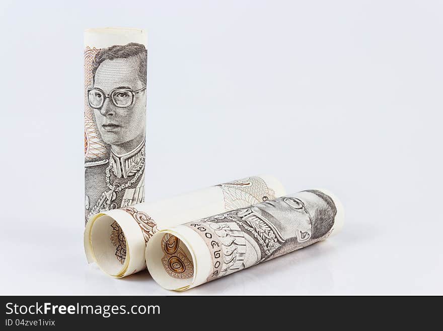 Roll of thai banknotes isolated on white background