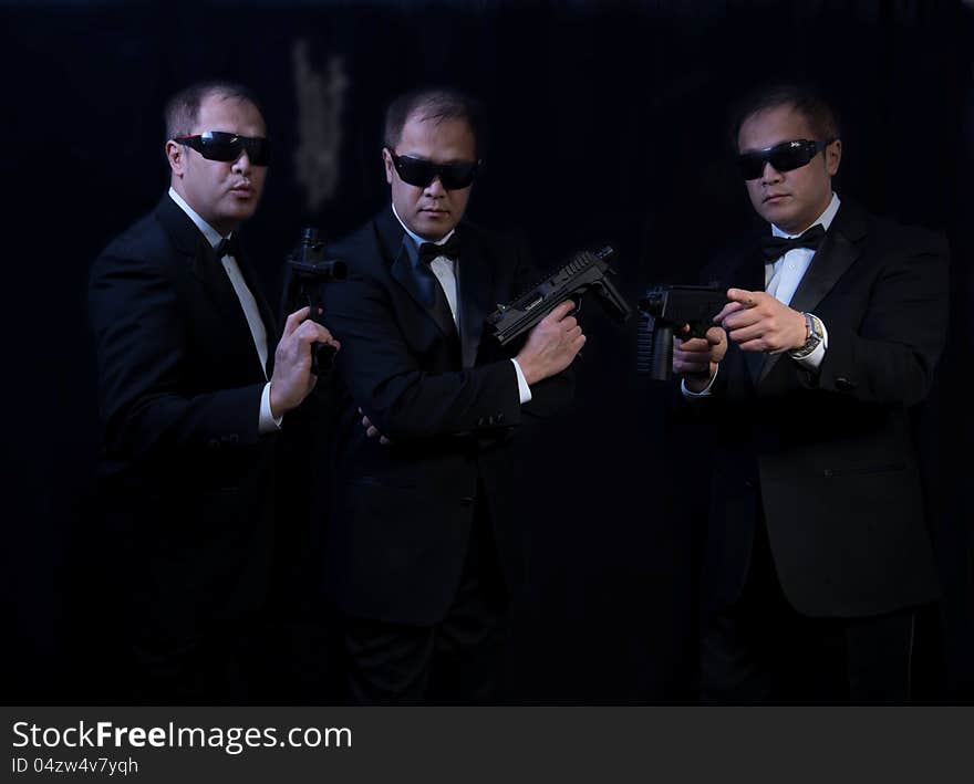 Bodyguards with gun to protect his master