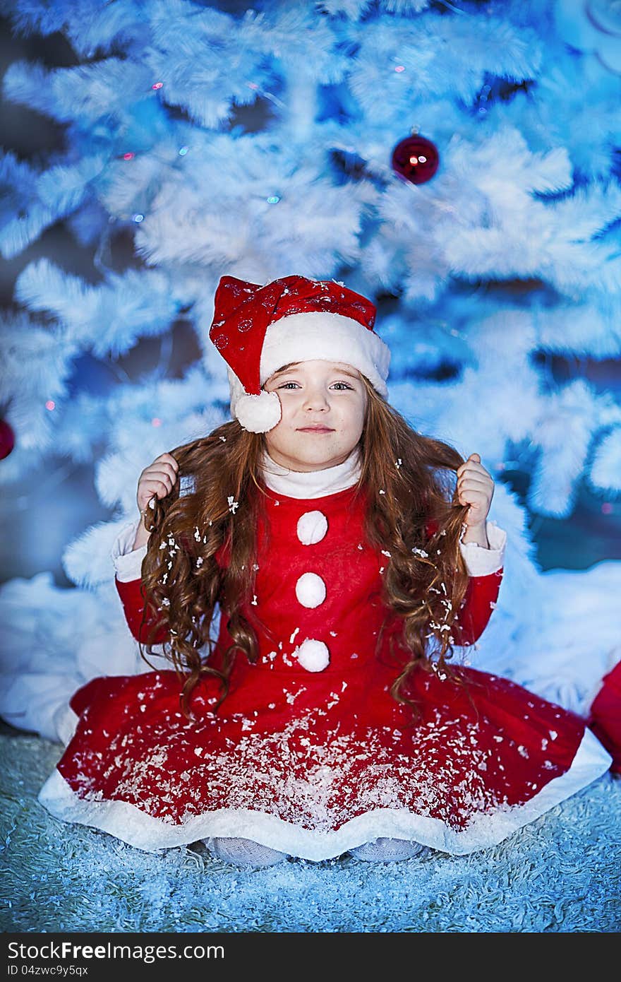 Cute girl and Christmas Tree