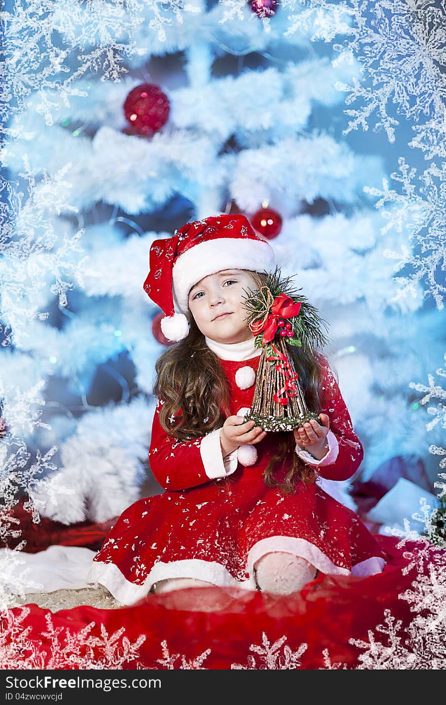 Cute girl and Christmas Tree