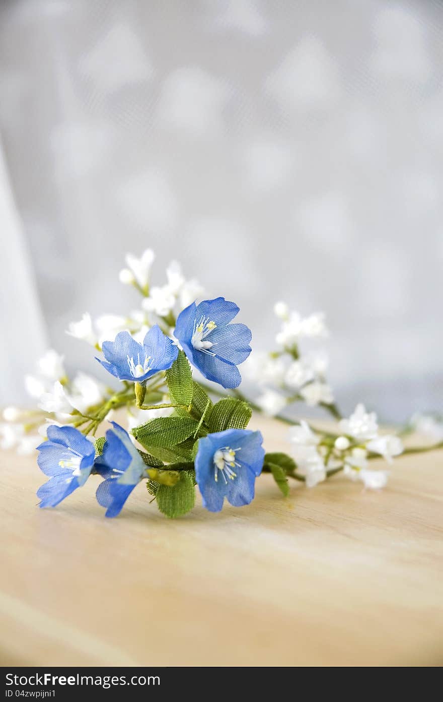 Little artificial flowers in morning light