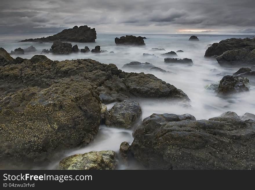 Exposure of a coastal tide surging through a cove. Exposure of a coastal tide surging through a cove.