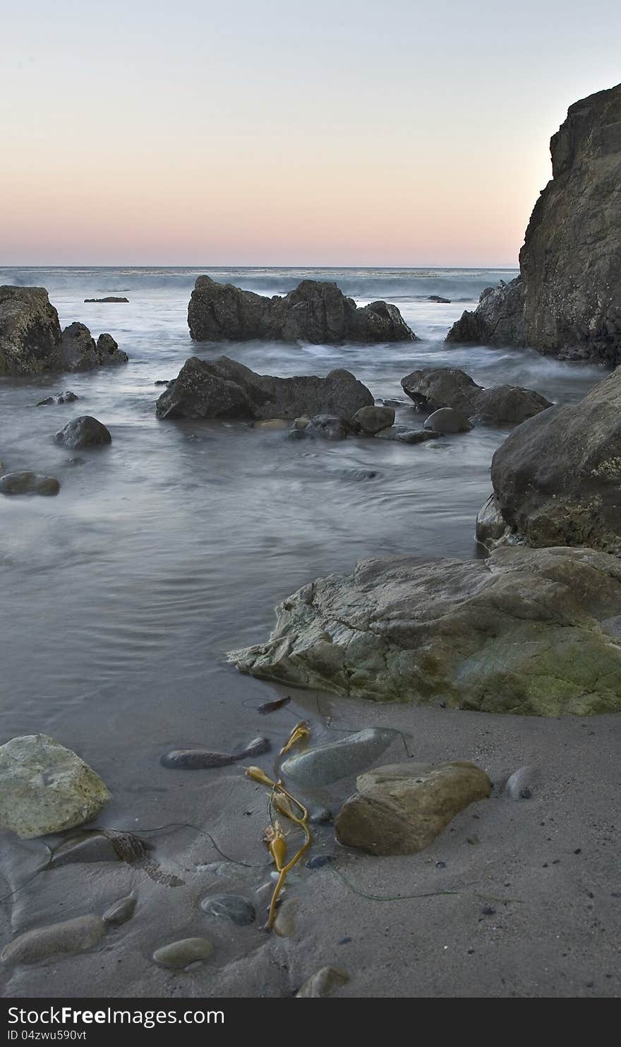 Exposure of a coastal tide surging through a cove. Exposure of a coastal tide surging through a cove.