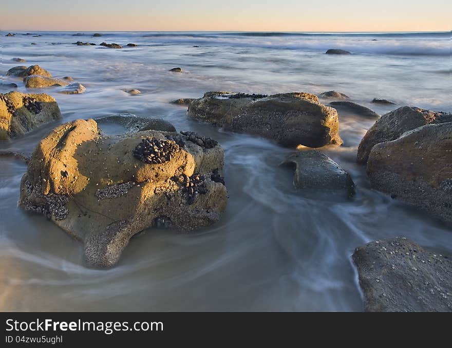 Exposure of a coastal tide surging through a cove. Exposure of a coastal tide surging through a cove.