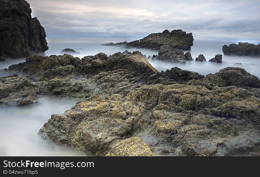 Exposure of a coastal tide surging through a cove. Exposure of a coastal tide surging through a cove.