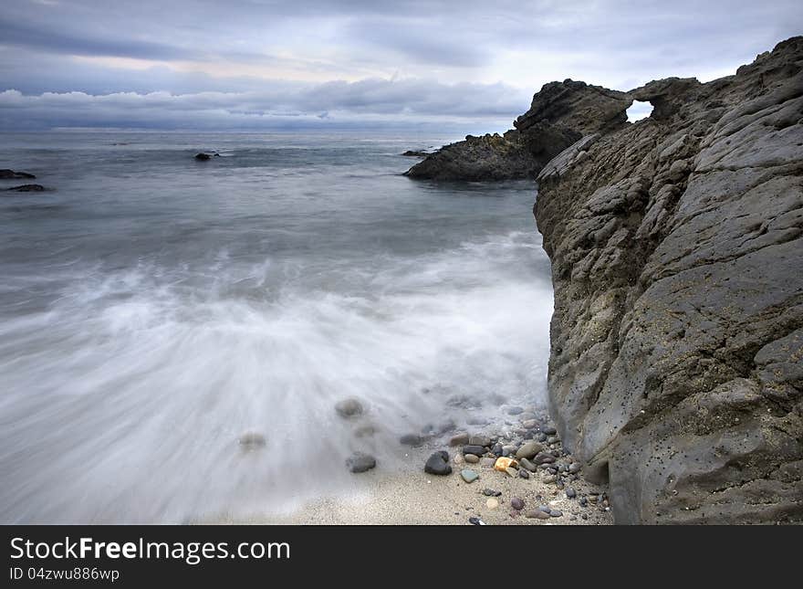 Exposure of a coastal tide surging through a cove. Exposure of a coastal tide surging through a cove.