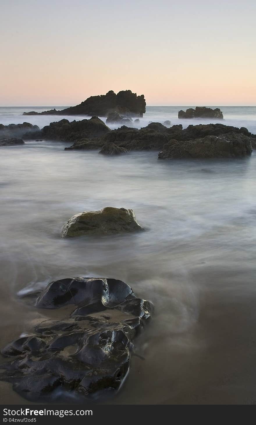 Exposure of a coastal tide surging through a cove. Exposure of a coastal tide surging through a cove.